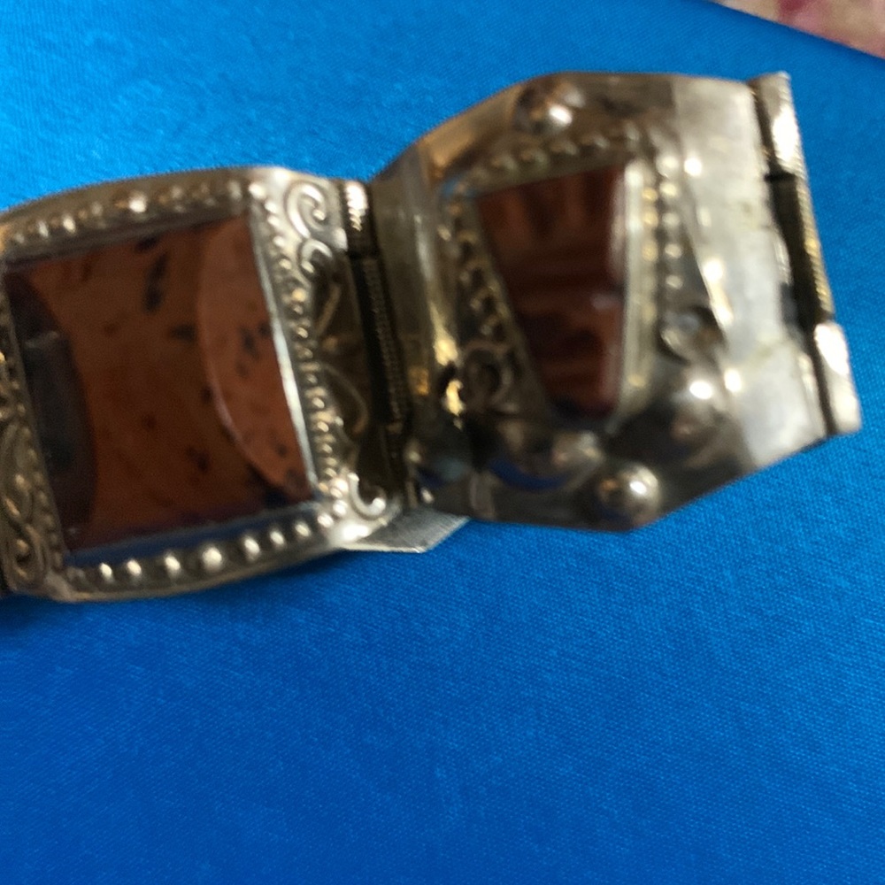 An old bracelet with brown stones. Has a good closure has been taken care of